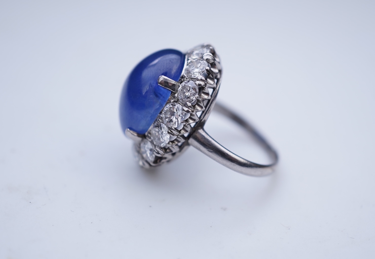 A sapphire and diamond ring, mid 20th century
